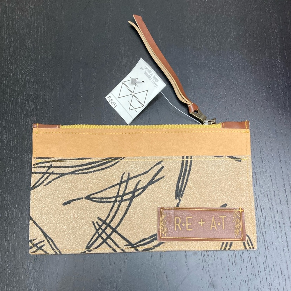 RE+AT leather wristlet